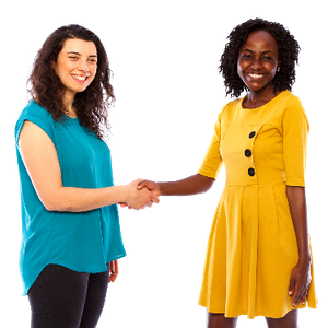 Two women smiling and shaking hands